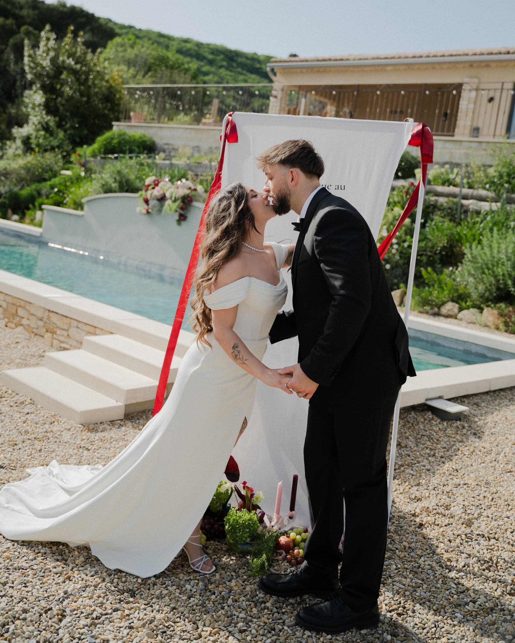 Bride and groom kiss at their ceremony, destination wedding in Provence, France