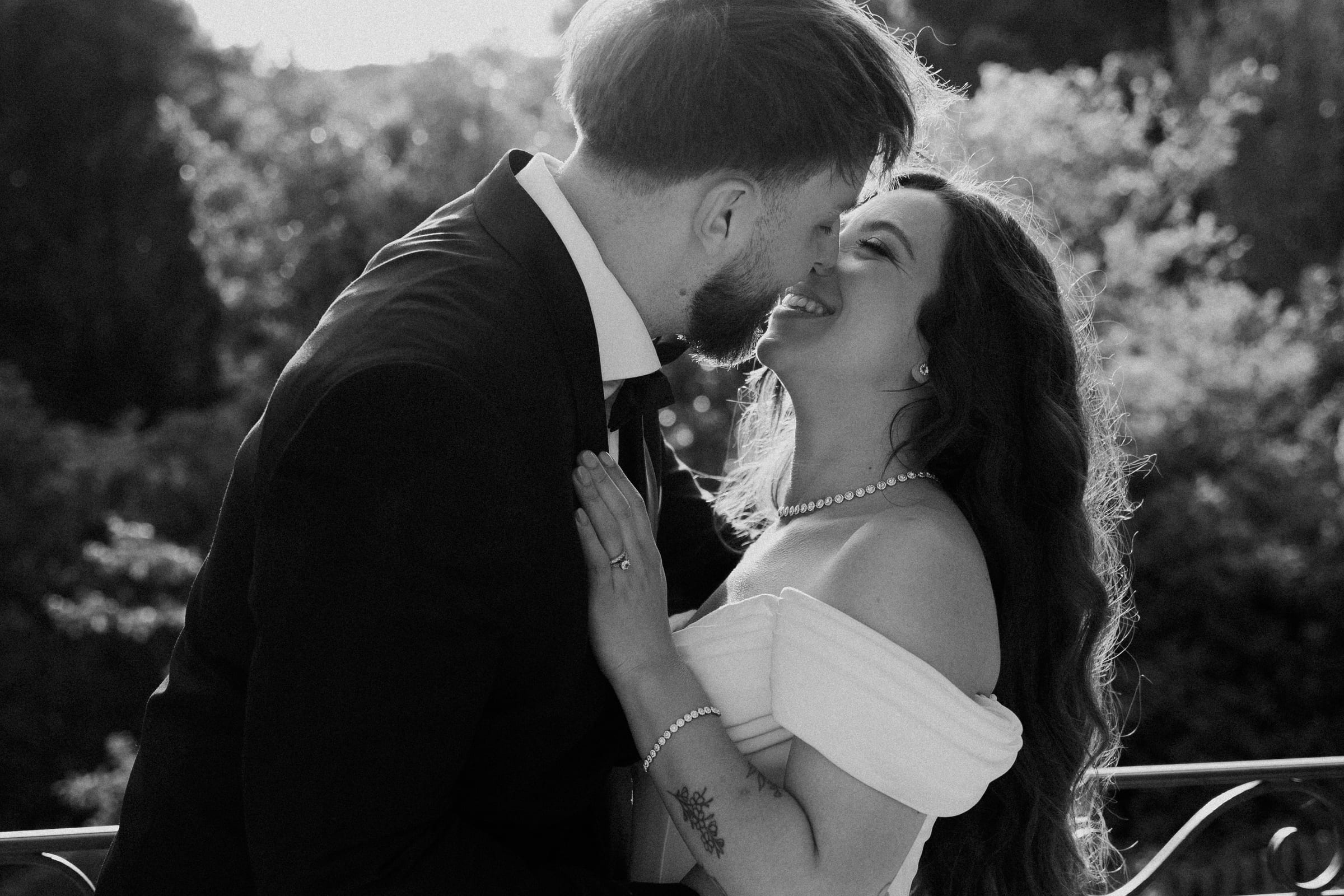Bride and groom laughing together at their destination wedding in France
